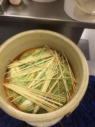 Bambo sticks help hold all down. Much CO2 gas is released during fermentation.